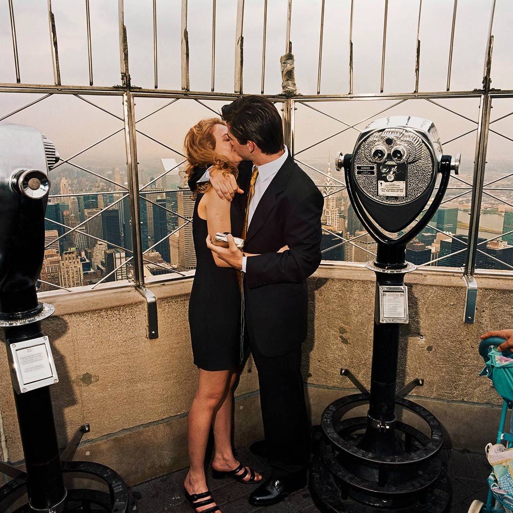 Kissing Couple atop Empire State Building, NYC 2000 - Sightseer Series - Photo by Roger Minick