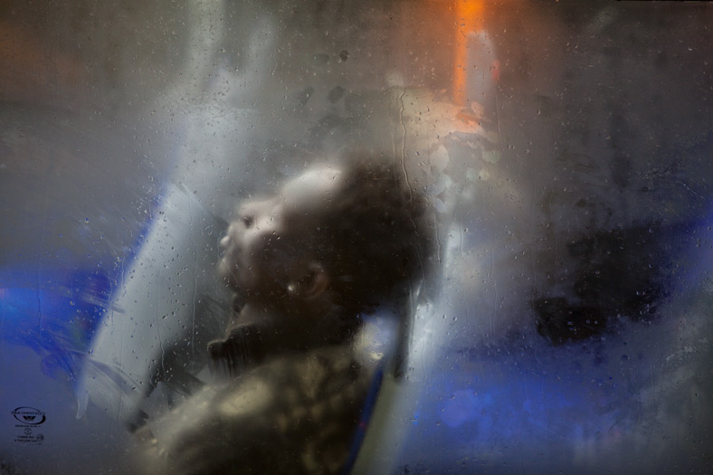 Winter London Bus Passengers - Through a Glass Darkly - Photo by Nick Turpin