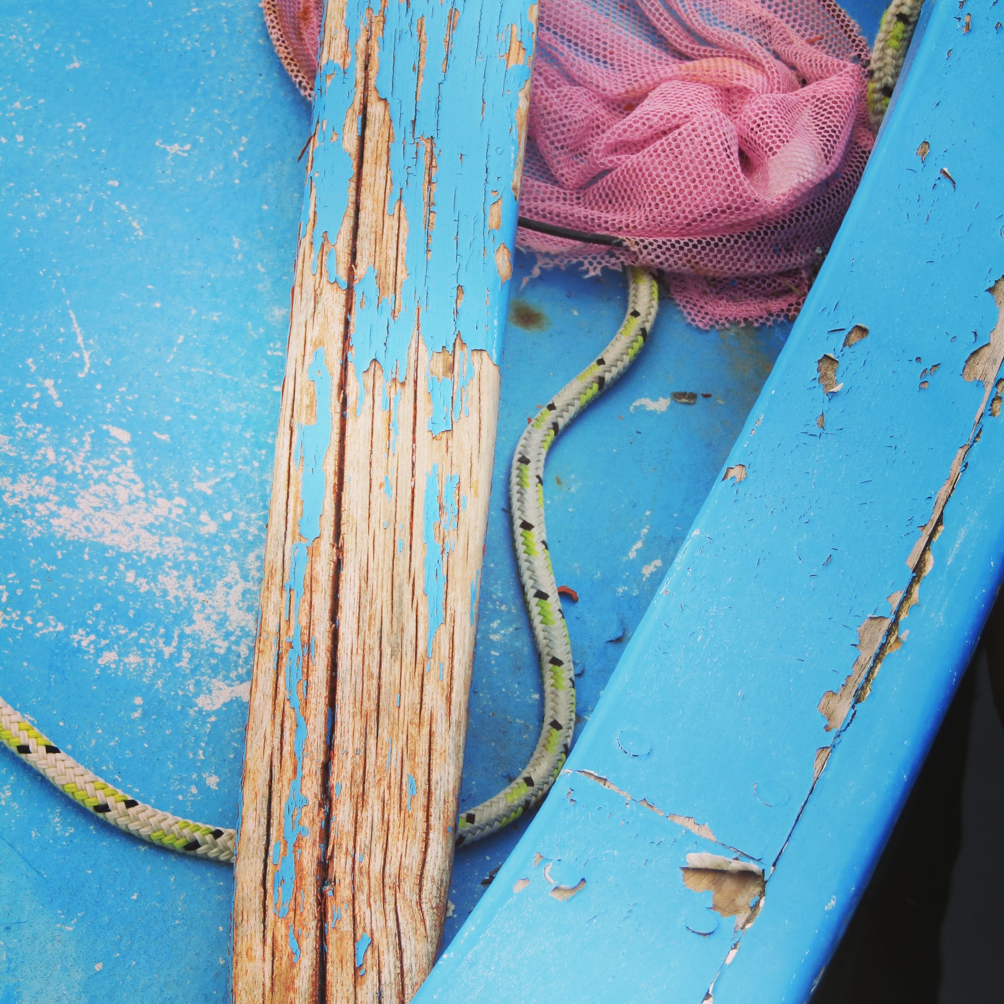 Weathered boat, sail and oar by jonesyinc